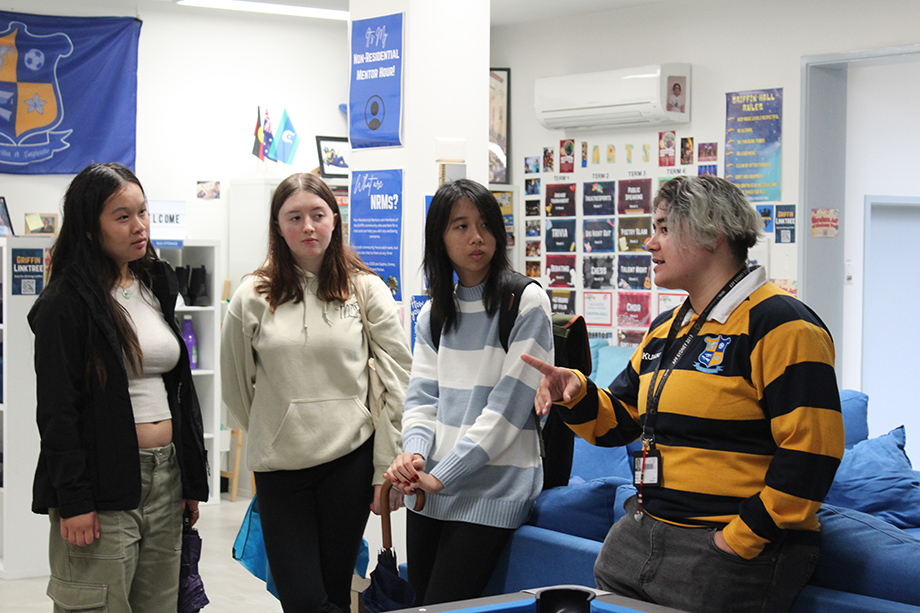 A staff introducing the room to 3 people