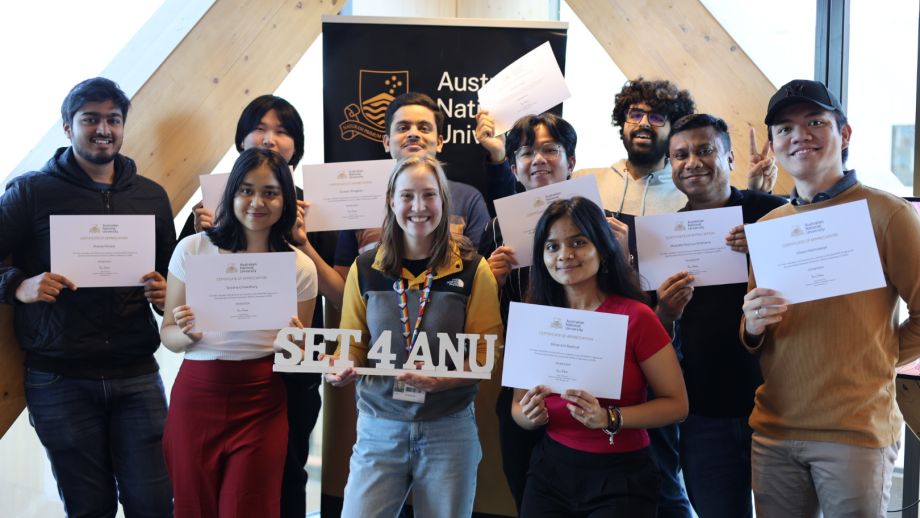 A group of mentors smiling and holding certificates