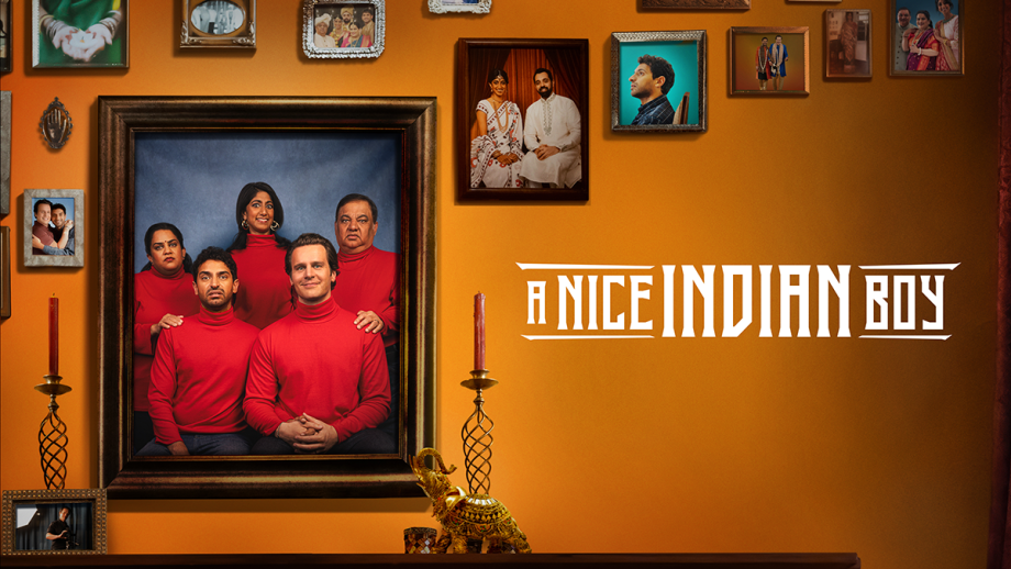 Pictured: A Nice Indian Boy cover image. Gallery style family photo frames of the characters with the largest displaying the family and new fiance in red sweaters smiling awkwardly