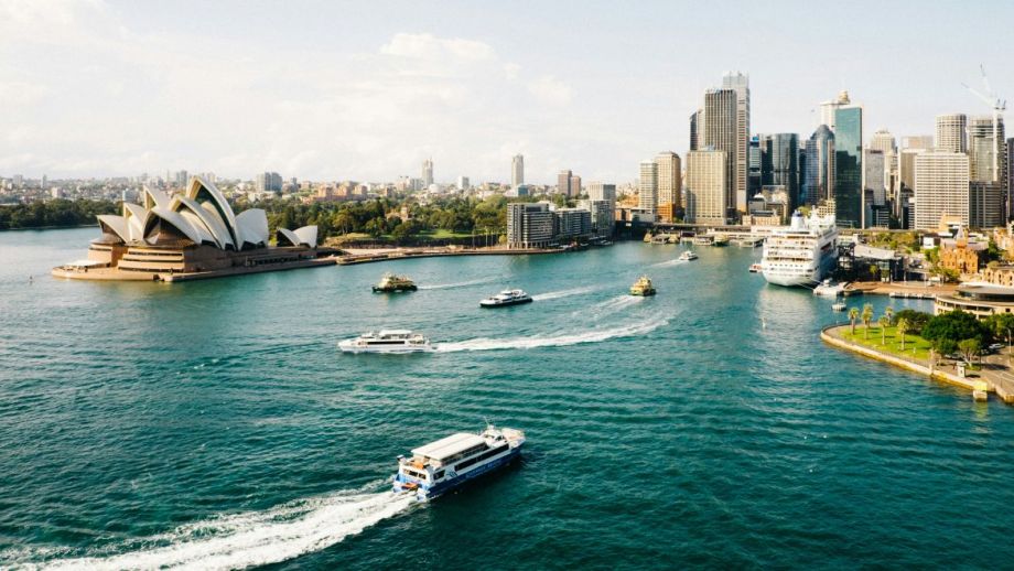 Pictured: Sydney skyline from the harbour looking at Sydney Opera House and boats