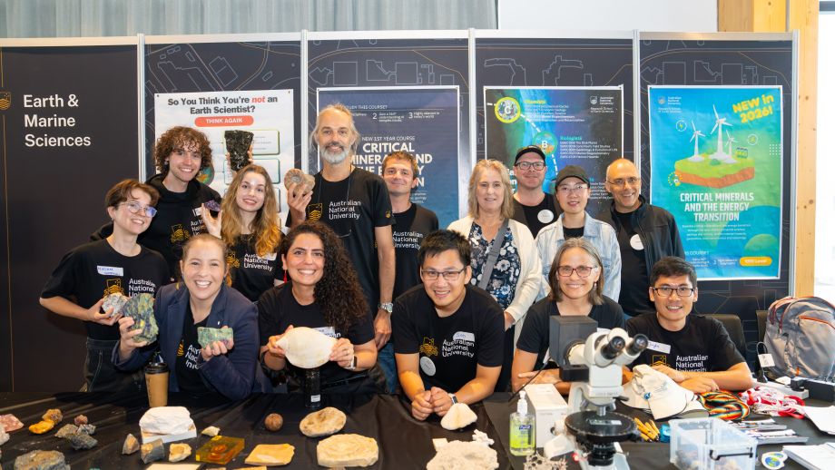 Group of people smiling at a stall