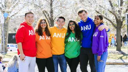 Students wearing rainbow ANU jumpers