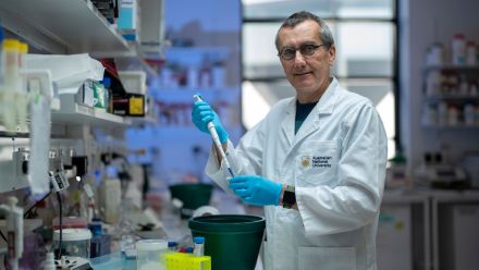 ANU scientist in a lab environment.