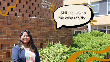 Rhi Zhan smiling in front of the Hayden-Allen building. There is a quote that reads ANU has given me wings to fly.