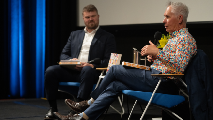 Mark Cully sits with Professor Alan Gamlen in the Kambri Theatre at the Meet the Author event on Monday 28 September.