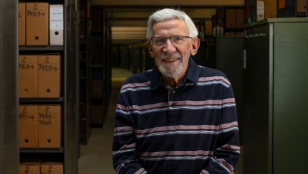 Dr Len Smith in the ANU Archives Underhill storage area where he is working with First Nations Portfolio to help digitise and categorise hundreds of boxes of 'orphan data' from the Briscoe-Smith Archive and reunite it with the rest of its data family in the Indigenous Metadata Catalogue.