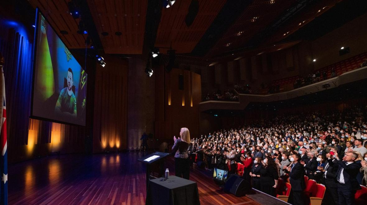 Ukrainian President Volodymyr Zelenskyy's address received a standing ovation from the crowd. Photo: Tracey Nearmy/ANU