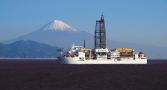 The world’s most advanced drilling-equipped science vessel, Chikyu sailing in the ocean with Mount Fuji in the background.