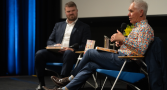 Mark Cully sits with Professor Alan Gamlen in the Kambri Theatre at the Meet the Author event on Monday 28 September.