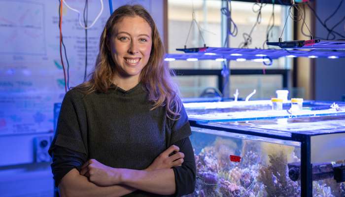 Image: Beth O’Sullivan tests her substrates and designs in the reef tank. Photo by Nic Vevers/ANU.
