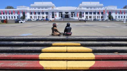 An painting of the Aboriginal flag opposite Old Parliament House, Canberra.