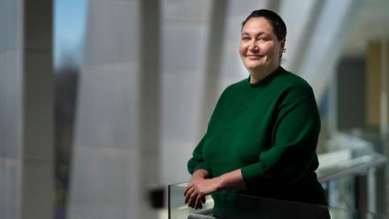 Associate Professor Azure Hermes. She is wearing a green top.