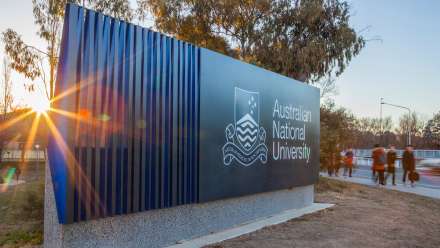 Image of ANU sign at sunset