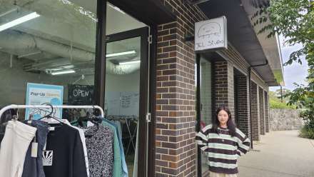 Woman standing outside of op shop