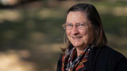 ºÚÁÏÌìÌÃAssociate Professor Julie Smith is wearing a black blazer and a scarf.