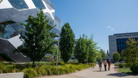 Students walk past the Research School of Biology in the Science Precinct at the Australian National University